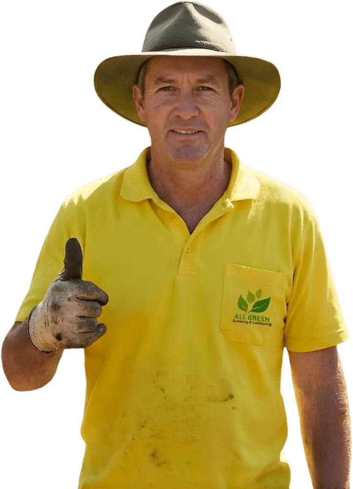 Gardener Sydney wearing a yellow work shirt and wide-brim hat, giving a thumbs up, with dirt-stained gloves after gardening work.