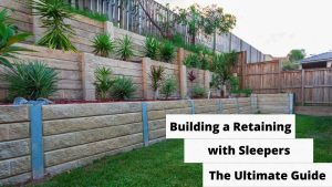 image represents Building a Retaining Wall with Sleepers: The Ultimate Guide