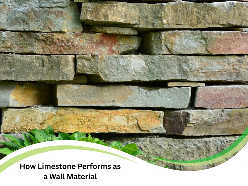 Stacked limestone retaining walls in a landscaped garden with green plants below.