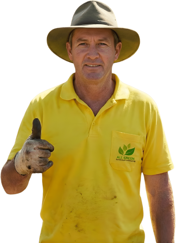 Gardener Sydney wearing a yellow work shirt and wide-brim hat, giving a thumbs up, with dirt-stained gloves after gardening work.